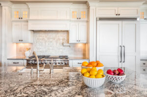 London101AlabasterbespokeinframekitchenhandpaintedexpertcarpentryexclusiveinteriordesignKitcheninteriorswithgraniteandintegratedappliancesandjimlawrencebrasshandlesandknobs